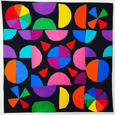 an abstract painting with different colors and shapes on black paper, which is cut into smaller circles