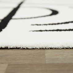 a white rug with black lines on it