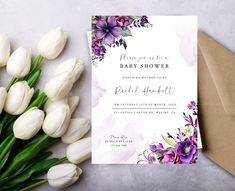 a bouquet of white tulips next to a card with the words, please you're baby shower