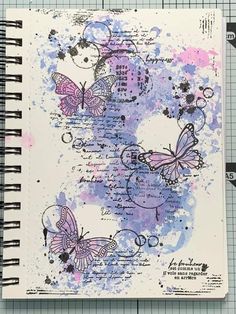 an open notebook with butterflies on it