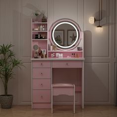 a pink vanity with a mirror and stool next to a potted plant on the floor