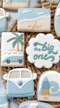 decorated cookies in the shape of cars and surfboards