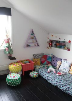 a child's bedroom with colorful furniture and decor