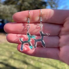 "Pair of Laser Cut and Engraved Balloon Dog Dangle Earrings * Created from 3mm thick acrylic on a professional grade laser * Each balloon dog is about 3/4\" tall by 1\" wide * A bit over 1-3/4 inches long from top of hook to bottom of the feet * Extremely lightweight - each individual earring weighs less than an ounce * Nickel Free and Hypoallergenic * Super cute and trendy! **Want a different size? Different color? We can do that! Just contact us and we will work with you to create what you are looking for!" Novelty Earrings, Engraved Acrylic, Dog Earrings, Balloon Dog, Sparkly Earrings, Earrings Unique, Gifts For My Sister, Pretty Earrings, Fun Earrings