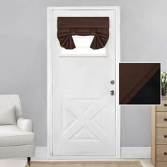 a living room with a white door, brown curtains and a chair in front of it