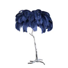 an ostrich's feathers are displayed on a tree branch in front of a white background