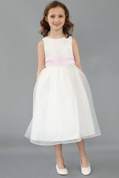 Please note: The price shown is for the dress only. The price will increase if accessories are added The Organza Tank Dress is the perfect dress for your Flowergirl! The dress is fully lined, and is designed and lovingly made to be soft, and comfortable, so that your little one can shine. The dress is a tea-length gown. Available in both white and ivory. Complete the look by choosing a sash that matches the dress or one that matches your bridal party. This dress is one our iconic Us Angels Flowe Girls Communion Dresses, Girls Dress Shop, Be Soft, Girls Sleepwear, Organza Dress, Communion Dresses, Girls Party Dress, Girl Dresses