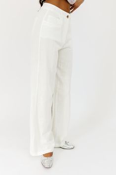 the perfect “go-with-anything” wide leg bottoms to elevate all of your summer outfit ideas. you can dress these off-white linen pants up or down for beach days, summer picnics, + date nights. off white // wide leg, one button zip fly, belt loops, pockets paired with our isabella top model is 5'10" + wearing a small measurements are approximate + taken while laying flat small : waist 26” inseam 30.5” length 42” medium : waist 28” inseam 31” length 42.5” large : waist 30” inseam 31” length 43" mor Spring Off White Cotton Wide Leg Pants, Off White Cotton Wide Leg Pants For Spring, Chic Off White Cotton Wide Leg Pants, White Linen Wide Leg Vacation Pants, White Linen Wide Leg Pants For Vacation, Chic Linen Wide Leg Pants For Day Out, White Wide Leg Pants For Summer Vacation, Chic White Wide Leg Pants With Relaxed Fit, White Cotton Wide Leg Pants For Day Out