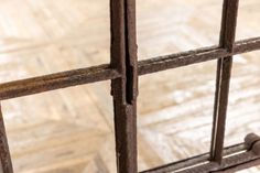 an old jail cell with bars and nails