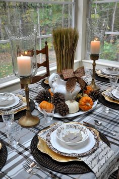 a dining room table set for thanksgiving dinner