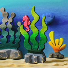 an image of seahorses and corals on the beach