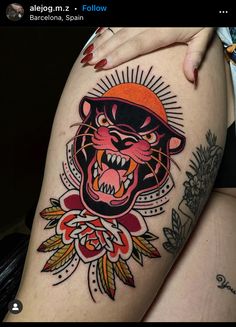 a woman's thigh with a tattoo on it and an image of a tiger