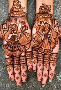 two hands with henna designs on them, one is showing the bride and groom