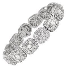 Sensational illusion set diamond bracelet with the look of emerald cut diamonds. High jewelry by Alexander Beverly Hills. 15.40 carats total of round and baguette cut diamonds. Approximately G/H color and VS clarity. 18k white gold, 6.25in. Accommodated with an up-to-date digital appraisal by a GIA G.G. once purchased, upon request. Please contact us with any questions. Item Number B3579 Christian Dior Bracelet, Modern Diamond Jewelry, Bling Bra, White Gold Diamond Bracelet, Peridot Bracelet, Malachite Bracelet, Expensive Jewelry Luxury, Gold Bracelet Set, Set Bracelet