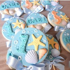 some cookies are decorated with sea animals and seashells