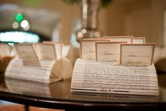 there are some papers on the table with place cards