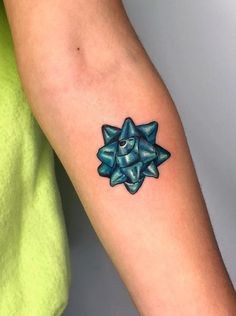 a person with a small tattoo on their arm