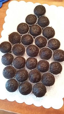 a bunch of chocolate cupcakes sitting on top of a paper towel