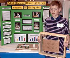 a young boy standing in front of a display