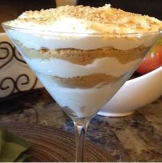 a dessert in a martini glass on a table