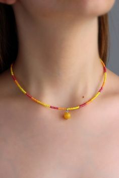 Pretty summer choker necklace with natural polished agate stone 8 mm bead, yellow, red plastic seed beads, two layers of strong nylon thread, silver tone claps and silver tone lobster claw with stainless steel chain. Perfect for everyday wear or a lovely gift! The length of necklace is about 39.5 cm or about 15.5 inches and about 4 cm of adjustable length chain. Other necklaces you can find in my store in the necklace section. https://www.etsy.com/shop/NaTavelli?section_id=14843046&ref=shopsecti Beaded Summer Necklace, Beaded Choker Ideas, Orange Necklaces, Golden Choker, Orange Beaded Necklace, Seed Beads Necklace, Summer Choker, Plastic Necklace