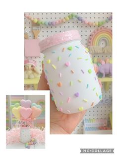 a hand holding a cup with sprinkles on it