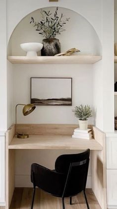 a chair sitting on top of a wooden desk next to a shelf filled with books