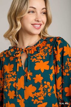 UmgeeTwo tone floral printed balloon sleeve babydoll peplum blouse with ruffle layer detail. Unlined. 3/4 sleeve, neckline self tie. Super popular and cute!Color: Teal MixSizes: S-M-L Our model is 5' 9" wearing a small.100% PolyesterT5/K7622 Green Floral Print Blouse With Ruffle Sleeves, Floral Print Tie Neck Blouse For Fall, Peplum Blouse, Floral Blouse, Two Tone, Baby Dolls, Floral Prints, Floral, How To Wear