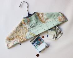 the money is laid out on top of the map, and it's attached to a hook