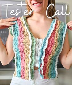 a woman wearing a multicolored vest with the words tester call on it