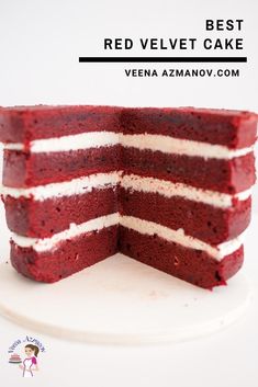 there is a red velvet cake with white frosting on the top and one slice cut out