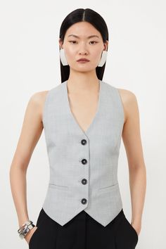 Tailored To An Idyllic Fit, This Chic Vest Is A Staple In Any Closet. Cascading Buttons Create A Flattering Hourglass Silhouette, While A Sleeveless Design And V-Neck Add A Classic Touch. An Ideal Trend-Forward Option From The Office To Dinner For A Sleek Ensemble.Tailoredwaistcoatsleeveless West Coat Suit For Women, Sleeveless Coats For Women, Vest As A Top, Ladies Waistcoat Outfit, Waist Coat For Women, Grey Waistcoat, Ladies Waistcoat, Waistcoat Outfit, Petite Wedding Guest Dresses