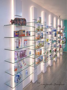 the shelves are filled with many different types of medicine bottles and containers, all lined up against each other