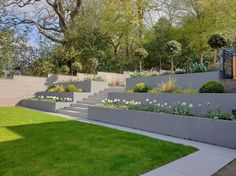 an outdoor garden with steps leading up to it