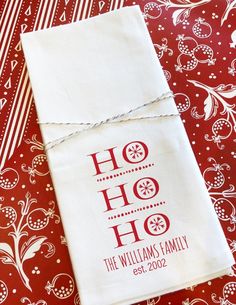 a red and white table cloth with the words ho ho on it