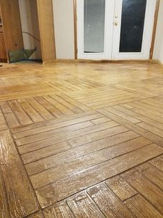 an empty room with hard wood flooring in it