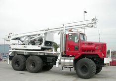 a large red truck parked in a parking lot