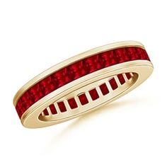 a yellow gold ring with red stones on the inside and outside, set against a white background