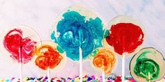 colorful candy lollipops are sitting on a table