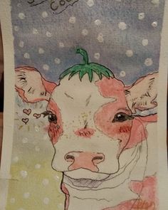 a drawing of a cow with a green leaf on it's head is shown