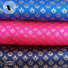 three different colored fabrics with gold and blue designs on them, one in the middle