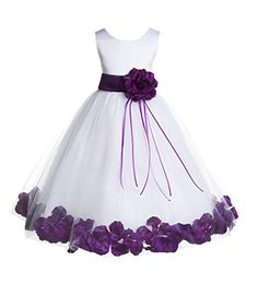 a white dress with purple flowers on the waist