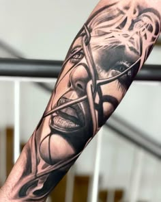 a man's arm with tattoos on it