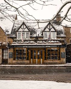 a building with snow on the roof and windows