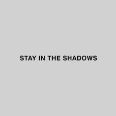 the words stay in the shadows are black and white on a gray background with an orange stripe