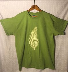 Unisex Large Light Green 6 oz. 100% Cotton T-shirt  Fern painted by hand with bleach Shirt has been washed to ensure full bleach removal from fabric Green Bleached Cotton T-shirt, Bleached Green Cotton T-shirt, Green Bleached Short Sleeve T-shirt, Painted T Shirt, Bleach Shirt, L And Light, Fern, Cotton T Shirt, Light Green