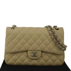 Item Details: Unleash timeless sophistication with the Chanel Jumbo Flap Bag, a luxury statement piece. Crafted with Chanel's iconic design and exquisite craftsmanship, this bag elevates any ensemble, making it a coveted accessory for discerning fashion enthusiasts. Series: Classic Jumbo Double Flap Style: Shoulder/Crossbody Bag Material: Quilted Leather Color: Beige Made:?ÿItaly Measurements: W 12" D 3.5" H 8" Accessories:?ÿDust Bag. Condition Detail:?ÿ Very Good - The Item is gently used and may have minor corner rubbing, light leather tanning, some inside stain marks, and slight signs of use on hardware. See the listing description for details. Outside: Signs of use. Inside: Dirt marks, dirt, signs of use. Leather: Dirt marks, signs of use. Corners: Light rubbing, dirt marks, dark color Luxury Classic Quilted Shoulder Bag, Luxury Tan Flap Bag, Designer Quilted Luxury Flap Bag, Luxury Designer Quilted Flap Bag, Luxury Timeless Double Flap Bag, Luxury Dark Tan Leather Bags, Chanel Jumbo Flap Bag, Chanel Jumbo Flap, Chanel Classic Jumbo