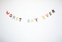 a banner that says worst day ever hanging on a wall