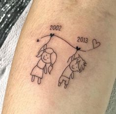 a tattoo on the leg of a person with a dog and heart balloon attached to it