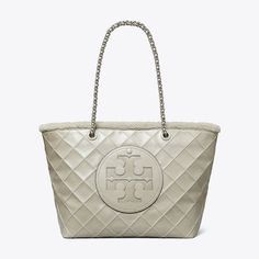 Our Ella Chain Tote is made of shearling-lined leather with diamond pattern pintucks. Ideal for every day, it has a roomy interior for all the essentials, including a laptop. Ella Tote, Tory Burch Ella, Designer Tote Bags, Barrel Bag, Womens Designer Handbags, Designer Totes, Quilting Techniques, Leather Wraps, Tote Bag Design